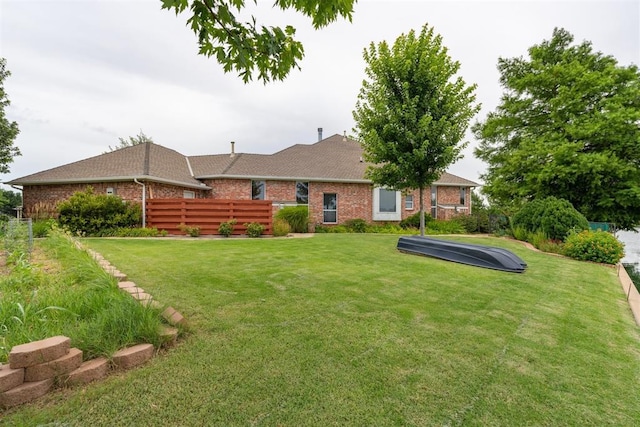 8404 NW 65th Pl, Oklahoma City, OK 73132 - rear view of property with brick siding and roof with shingles