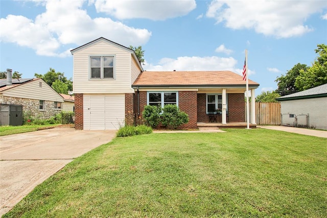 3213 SE 20th St, Del City, OK 73115 - view of front of home featuring brick siding, a garage, concrete driveway, and a porch