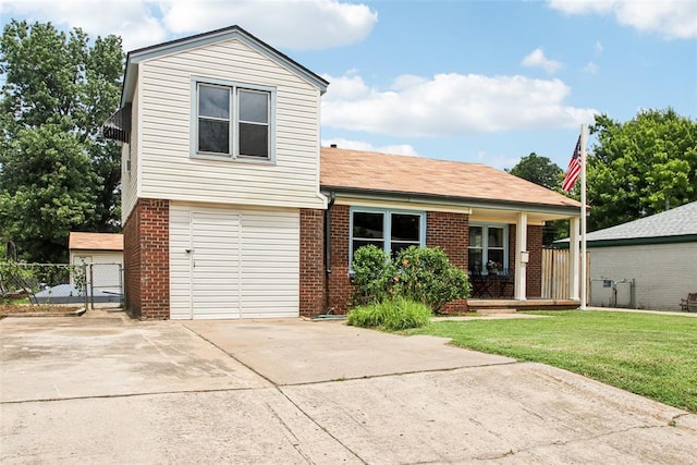 3213 SE 20th St, Del City, OK 73115 - view of front facade featuring brick siding, a garage, driveway, a porch, and a gate