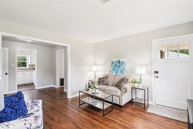 3213 SE 20th St, Del City, OK 73115 - living room featuring wood finished floors and baseboards