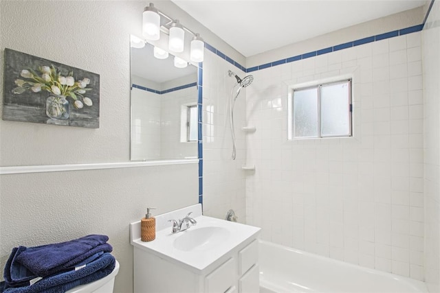 3213 SE 20th St, Del City, OK 73115 - bathroom featuring vanity, shower / bath combination, and a textured wall