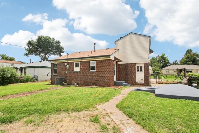 3213 SE 20th St, Del City, OK 73115 - rear view of property with brick siding and a yard