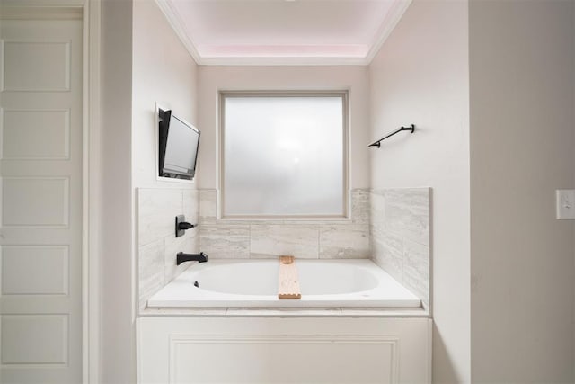 8317 Poplar Dr, Edmond, OK 73034 - bathroom featuring a garden tub and ornamental molding