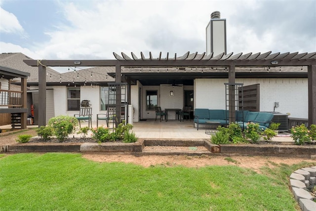 8317 Poplar Dr, Edmond, OK 73034 - back of property with ceiling fan, brick siding, outdoor lounge area, a patio area, and a lawn