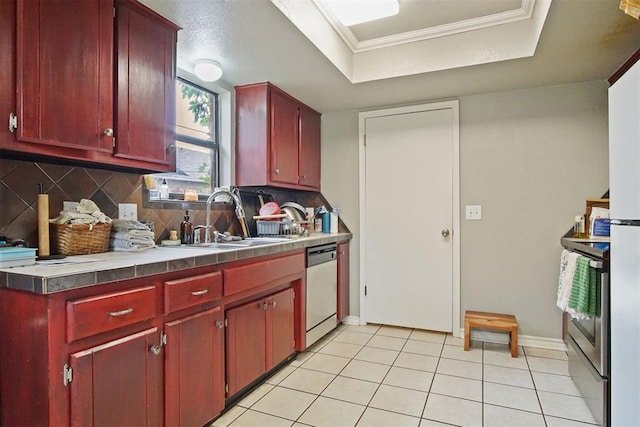 1713 Apian Way, Edmond, OK 73003 - kitchen with stainless steel appliances, dark brown cabinets, tasteful backsplash, and crown molding