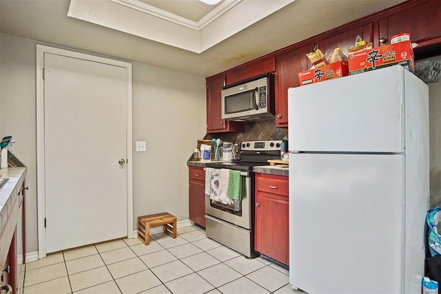 1713 Apian Way, Edmond, OK 73003 - kitchen with appliances with stainless steel finishes, backsplash, light tile patterned floors, crown molding, and dark brown cabinets