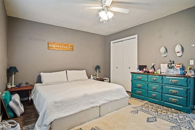 1713 Apian Way, Edmond, OK 73003 - bedroom featuring a closet, a ceiling fan, and wood finished floors