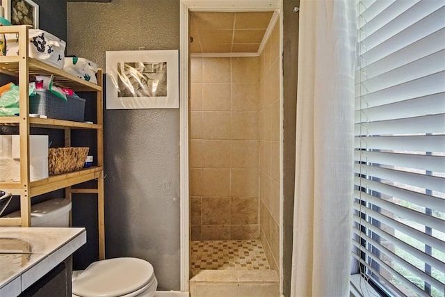 1713 Apian Way, Edmond, OK 73003 - bathroom with a shower stall, a textured wall, and vanity