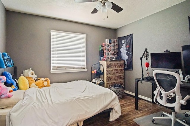 1713 Apian Way, Edmond, OK 73003 - bedroom featuring wood finished floors, ceiling fan, and a textured ceiling