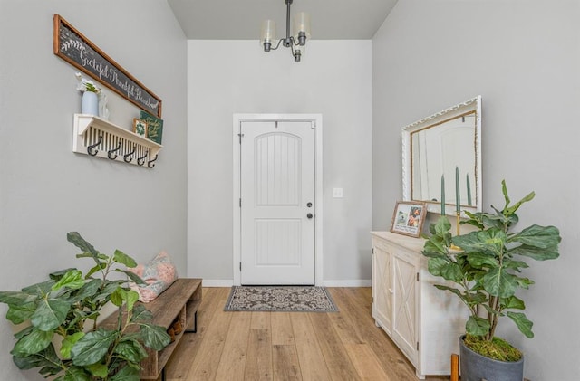 321 SW 147th St, Oklahoma City, OK 73160 - foyer with light wood-type flooring and a chandelier