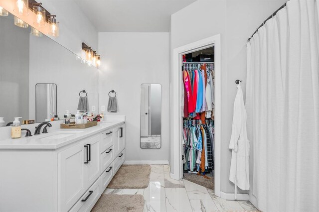 321 SW 147th St, Oklahoma City, OK 73160 - full bath with double vanity, marble finish flooring, and a walk in closet