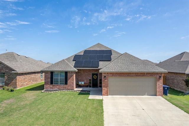 321 SW 147th St, Oklahoma City, OK 73160 - view of front of home with roof with shingles, a garage, brick siding, and driveway
