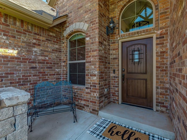 1470 Auburn Cir, Piedmont, OK 73078 - doorway to property featuring brick siding and a shingled roof