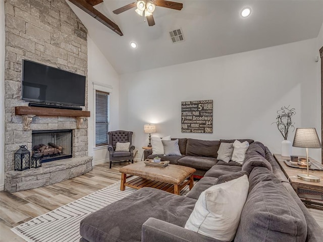 1470 Auburn Cir, Piedmont, OK 73078 - living room featuring ceiling fan, wood finished floors, beam ceiling, a fireplace, and high vaulted ceiling
