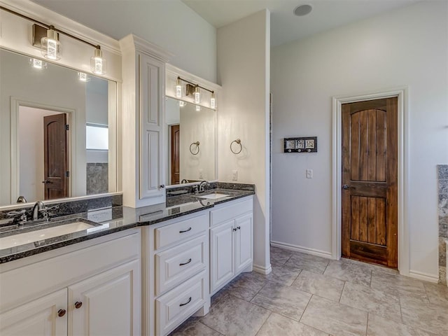 1470 Auburn Cir, Piedmont, OK 73078 - bathroom featuring double vanity and baseboards