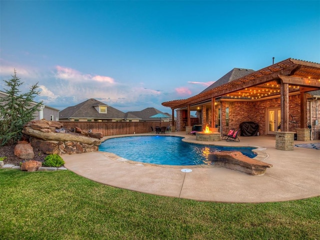 1470 Auburn Cir, Piedmont, OK 73078 - pool at dusk with a fire pit and a patio