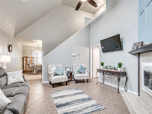 1011 SW 22nd St, Moore, OK 73170 - living area with a chandelier, light tile patterned floors, a ceiling fan, and high vaulted ceiling
