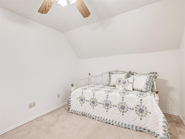 1011 SW 22nd St, Moore, OK 73170 - bedroom featuring carpet, vaulted ceiling, and a ceiling fan