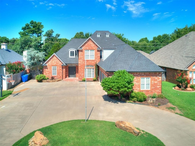 1008 Bentbrook Pl, Norman, OK 73072 - traditional-style home featuring driveway, brick siding, roof with shingles, and a garage