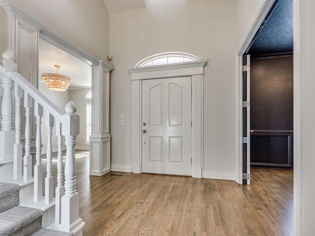 1008 Bentbrook Pl, Norman, OK 73072 - entryway with light wood-style flooring, stairs, and a towering ceiling