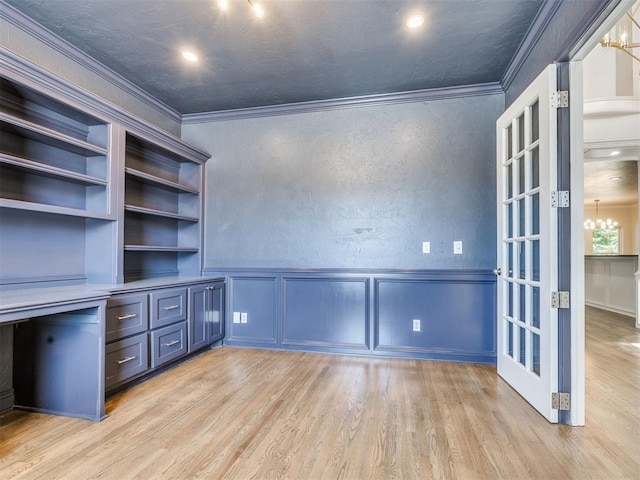 1008 Bentbrook Pl, Norman, OK 73072 - unfurnished office with a chandelier, ornamental molding, light wood-type flooring, a decorative wall, and a wainscoted wall