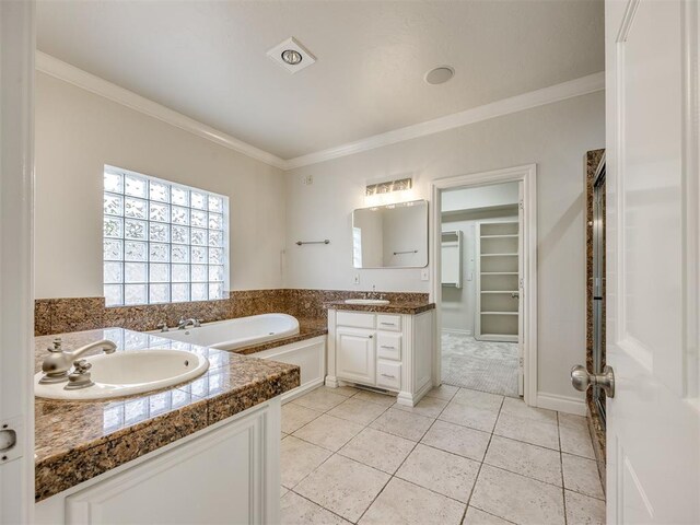 1008 Bentbrook Pl, Norman, OK 73072 - bathroom featuring vanity, a bath, ornamental molding, tile patterned floors, and a walk in closet