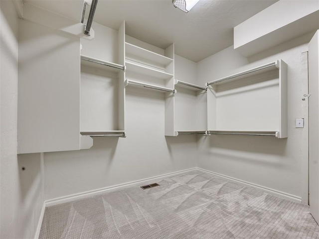 1008 Bentbrook Pl, Norman, OK 73072 - walk in closet featuring carpet