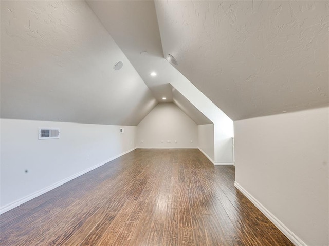 1008 Bentbrook Pl, Norman, OK 73072 - bonus room with lofted ceiling, wood finished floors, and recessed lighting