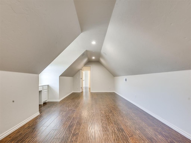 1008 Bentbrook Pl, Norman, OK 73072 - additional living space with lofted ceiling, dark wood-type flooring, and recessed lighting