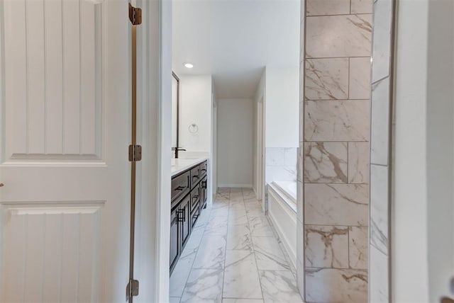 1632 NE 35th St, Moore, OK 73160 - bathroom with marble finish flooring, double vanity, a garden tub, and recessed lighting