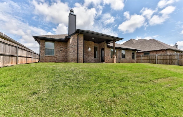 1632 NE 35th St, Moore, OK 73160 - rear view of property featuring brick siding and a chimney