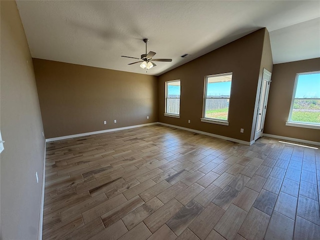 1808 Sommerset Pl, Altus, OK 73521 - spare room with lofted ceiling, wood tiled floors, and ceiling fan