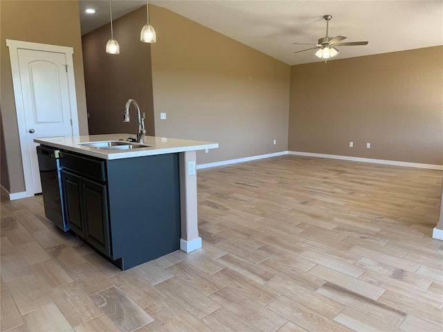 1808 Sommerset Pl, Altus, OK 73521 - kitchen featuring light wood-type flooring, light countertops, a ceiling fan, vaulted ceiling, and a kitchen island with sink