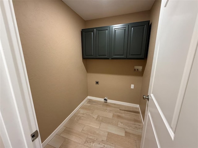 1808 Sommerset Pl, Altus, OK 73521 - laundry area featuring hookup for an electric dryer and cabinet space