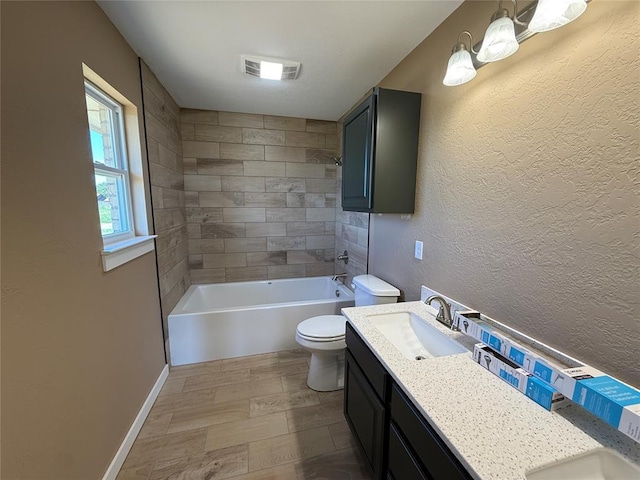 1808 Sommerset Pl, Altus, OK 73521 - full bathroom featuring double vanity, bathing tub / shower combination, a textured wall, and wood finished floors