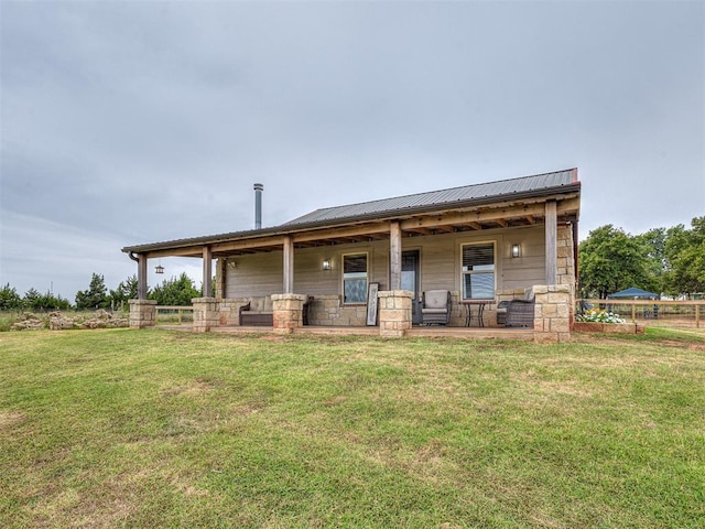1036 County St Unit 2982, Blanchard, OK 73010 - rear view of house with a metal roof, a yard, stone siding, and covered porch