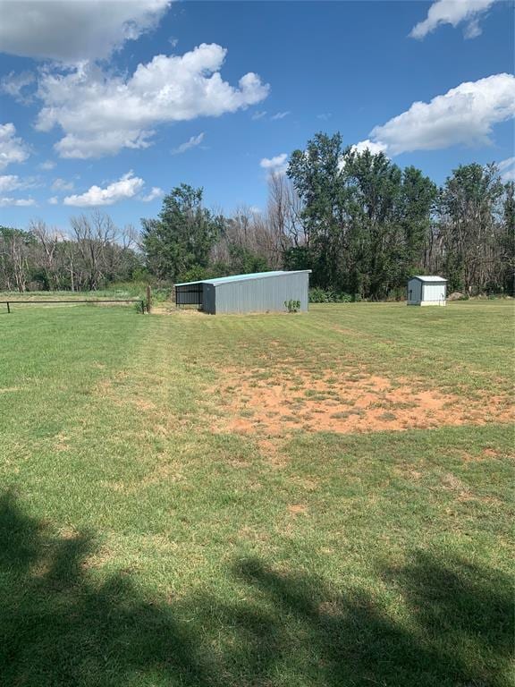 28153 County Street 2540Th, St, Fort Cobb, OK 73038 - view of green lawn with a pole building, a view of countryside, and a storage unit