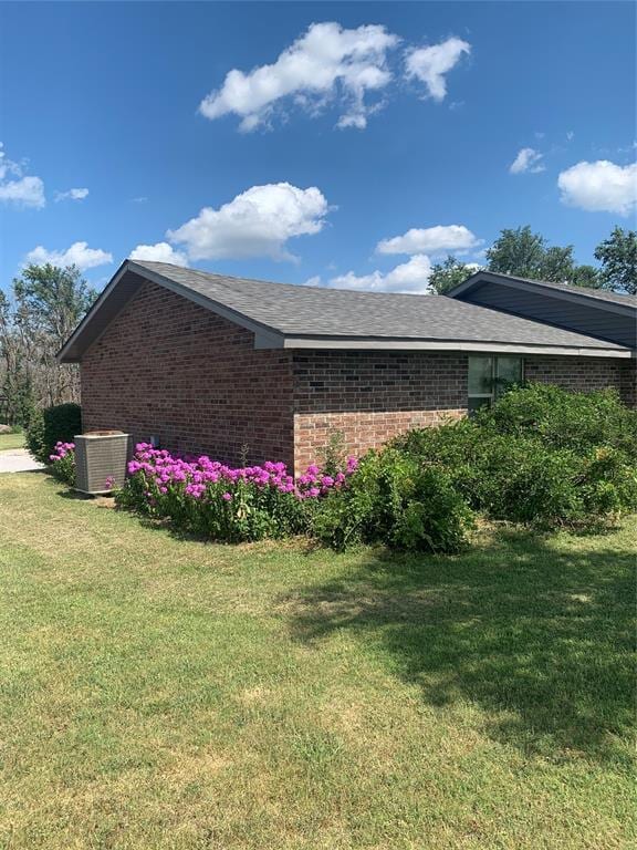 28153 County Street 2540Th, St, Fort Cobb, OK 73038 - view of home's exterior with brick siding and a yard