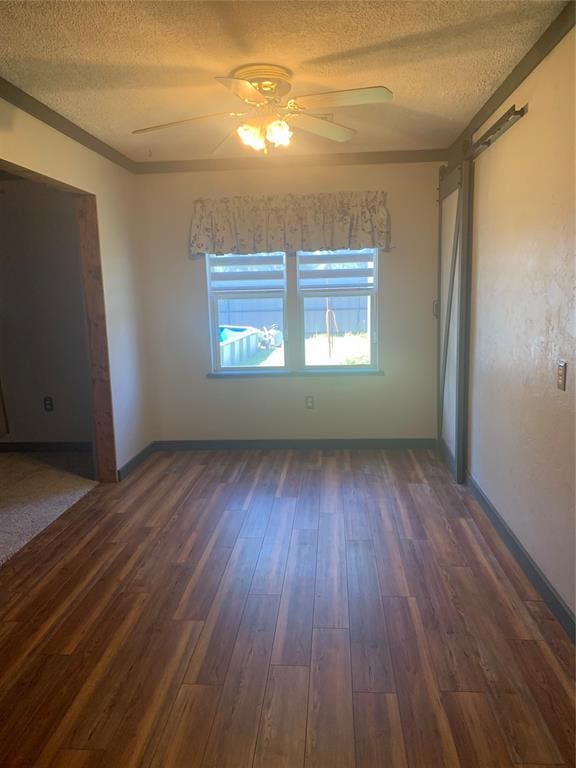 28153 County Street 2540Th, St, Fort Cobb, OK 73038 - unfurnished room featuring a textured ceiling, ceiling fan, and dark wood-style floors