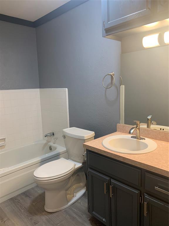 28153 County Street 2540Th, St, Fort Cobb, OK 73038 - full bath featuring wood finished floors, a bathtub, and vanity