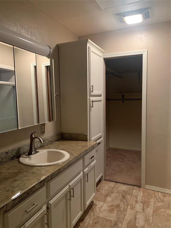 28153 County Street 2540Th, St, Fort Cobb, OK 73038 - bathroom featuring vanity and a spacious closet