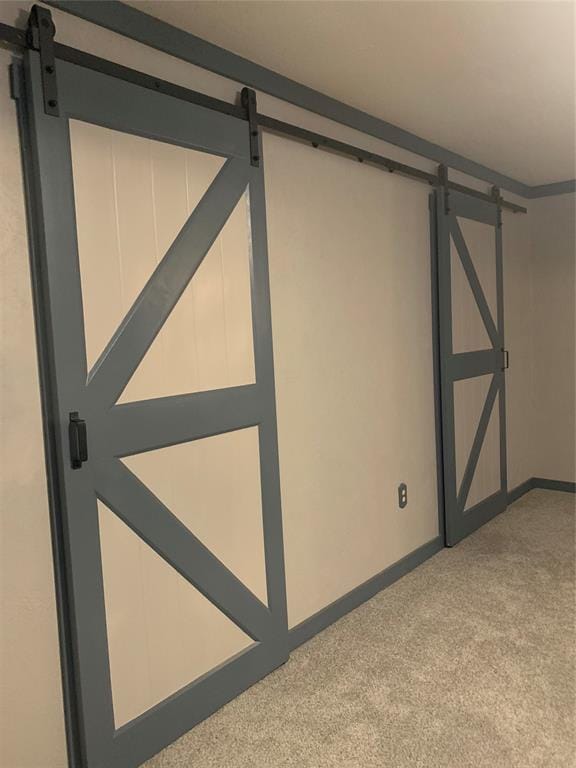 28153 County Street 2540Th, St, Fort Cobb, OK 73038 - interior space featuring a barn door and light carpet