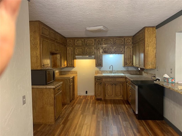 28153 County Street 2540Th, St, Fort Cobb, OK 73038 - kitchen featuring black microwave, dark wood-style flooring, a textured ceiling, and brown cabinetry