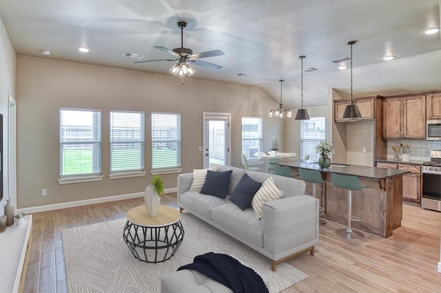 6413 SE 84th St, Oklahoma City, OK 73135 - living room with light wood-style floors, ceiling fan, vaulted ceiling, a chandelier, and recessed lighting