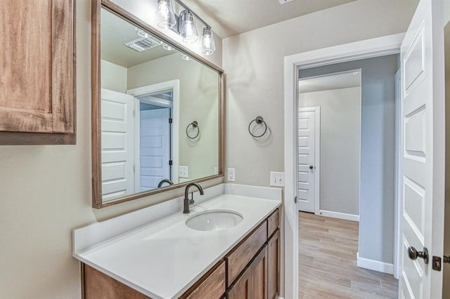 6413 SE 84th St, Oklahoma City, OK 73135 - bathroom with vanity and wood finished floors