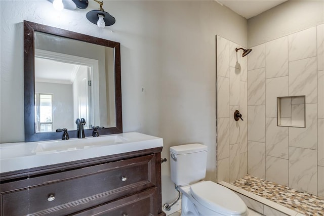 1800 NW 38th St, Oklahoma City, OK 73118 - bathroom with tiled shower, vanity, and ornamental molding