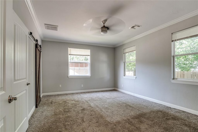 1800 NW 38th St, Oklahoma City, OK 73118 - unfurnished bedroom with a barn door, carpet floors, ornamental molding, and a ceiling fan