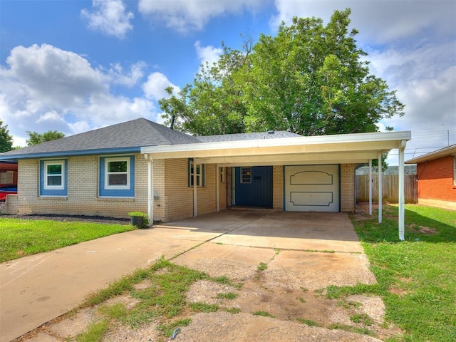 3044 S Madole Blvd, Oklahoma City, OK 73159 - ranch-style house with brick siding, concrete driveway, and an attached carport
