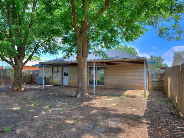 3044 S Madole Blvd, Oklahoma City, OK 73159 - back of property with a fenced backyard and brick siding