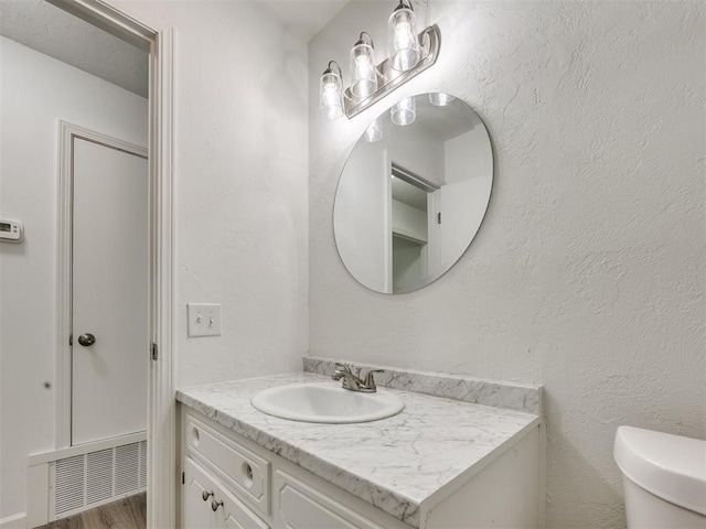 3044 S Madole Blvd, Oklahoma City, OK 73159 - half bathroom with vanity and wood finished floors